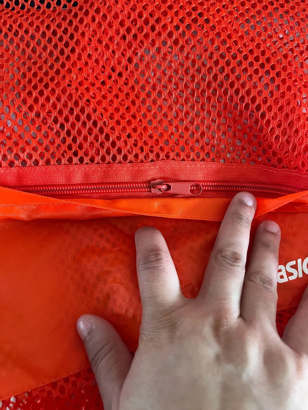 ASICS Bright Orange Mesh Drawstring Backpack